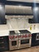 stainless steel range hood sloped design with mirror-like straps for under cabinet kitchen at RangeHoodMaster