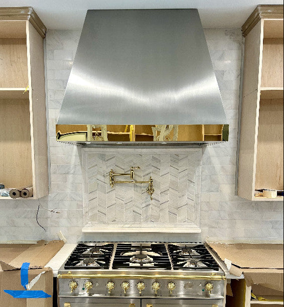 stainless steel range hood taper shape with polished brass apron at RangeHoodMaster