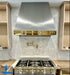stainless steel range hood taper shape with polished brass apron at RangeHoodMaster