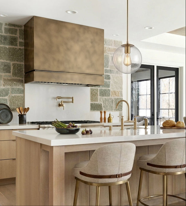 Custom brass box range hood with concave design at rangehoodmaster