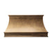 Handcrafted antique brass custom stove hood with crown molding detail in a luxury kitchen