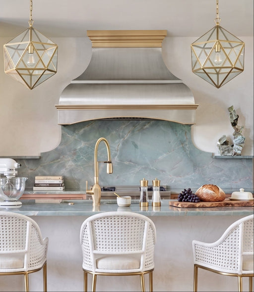 custom brushed stainless steel range hood with curved arch apron design and brushed brass crown molding handmade at rangehoodmaster