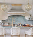 custom brushed stainless steel range hood with curved arch apron design and brushed brass crown molding handmade at rangehoodmaster