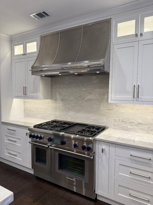 rangehoodmaster brushed stainless steel classic sloped shape with polished stainless steel mirror like straps & rivets & pot rail tailored for New York homes