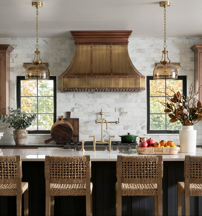 custom antique brass range hood with copper crown modling straps and rivets at rangehoodmaster