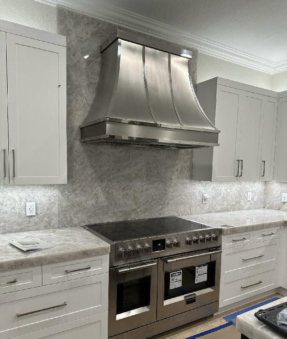 curved stainless steel range hood with mirror-like polished stainless steel straps and apron at RangeHoodMaster