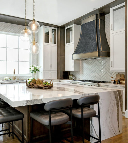 weathered blacken stainless steel custom range hoods with antique brushed brass straps and rivets modern curve shape at rangehoodmaster