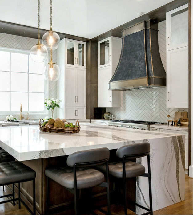 weathered blacken stainless steel custom range hoods with antique brushed brass straps and rivets modern curve shape at rangehoodmaster