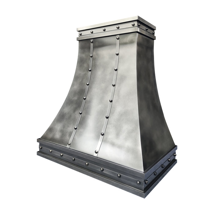 Custom antique blackened zinc curved range hood with stainless steel straps and rivets in industrial kitchen style