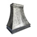 Custom antique blackened zinc curved range hood with stainless steel straps and rivets in industrial kitchen style