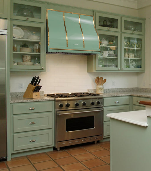 stainless steel range hood in custom green painted color with polished brass straps and pot rack at RangeHoodMaster