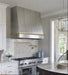 custom stainless steel range hood angled shape with straps and custom pot rail design at RangeHoodMaster