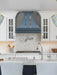 stainless steel range hood with custom blue color and bronze accents