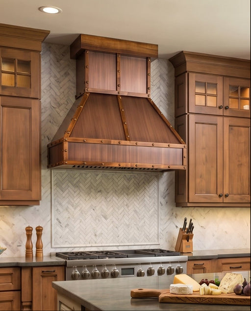 custom farmhouse copper range hood with wood trim angeld shape with rivets at rangehoodmaster