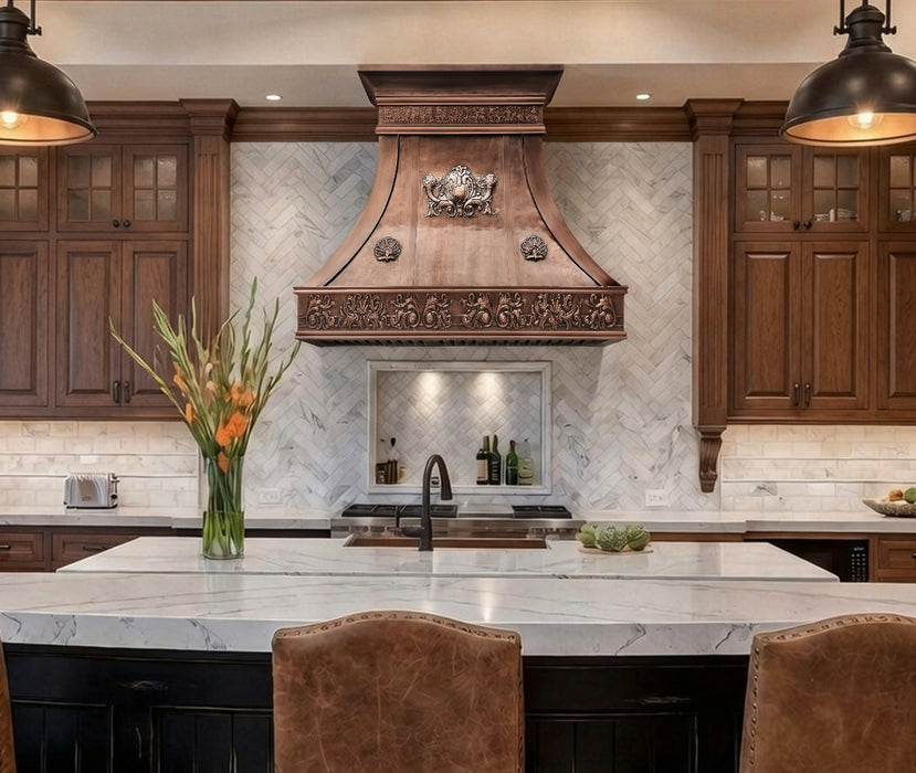custom copper range hood curved shape with crown and standing seams in 100% hand hammered pattern at rangehoodmaster