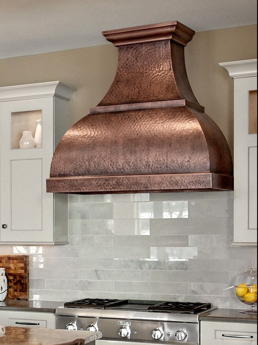 Handmade antique hammered copper range hood CT-VH01KA in a luxury farmhouse kitchen