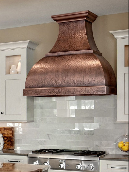 Handmade antique hammered copper range hood CT-VH01KA in a luxury farmhouse kitchen