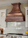 Handmade antique hammered copper range hood CT-VH01KA in a luxury farmhouse kitchen