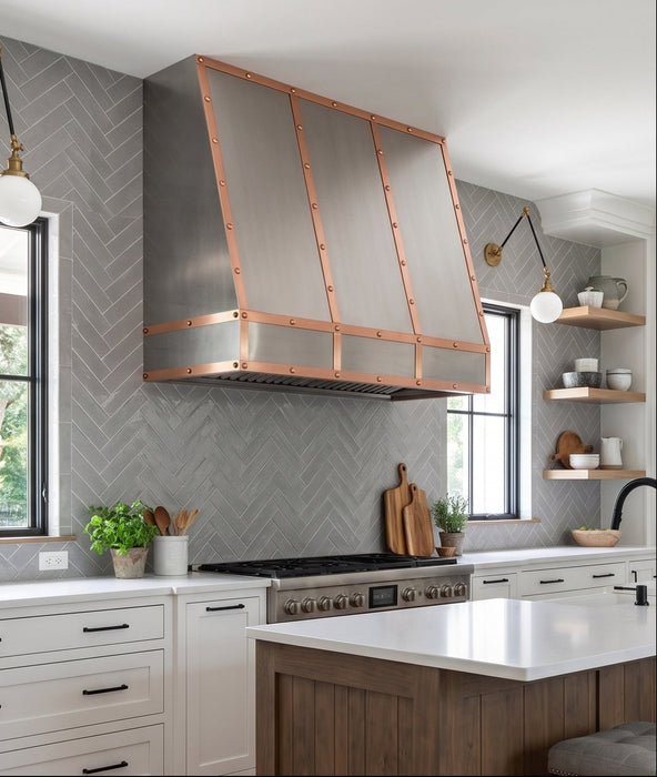 custom brushed stainless steel range hood with copper straps and rivets at rangehoodmaster