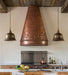handmade copper range hood with antique palm tree design at rangehoodmaster