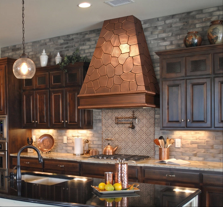 handmade copper range hood with hand hammered rock pattern at rangehoodmaster