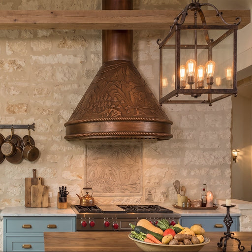 handmade copper range hood with mountain deer design at rangehoodmaster