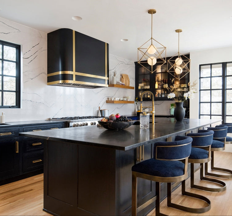 Handmade matte black custom range hood with curved iconic design in a modern luxury kitchen