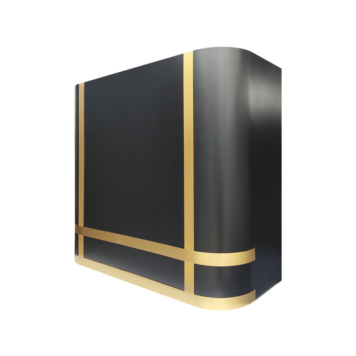 Handmade matte black custom range hood with curved iconic design in a modern luxury kitchen