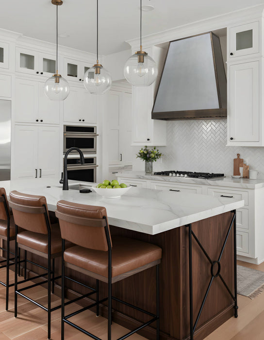 taper shape matte stainless steel range hood with antique brushed brass straps and apron at RangeHoodMaster