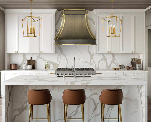custom brass range hood in luxury brushed antique brass finish with polished brass straps and black square rivets at RangeHoodMaster