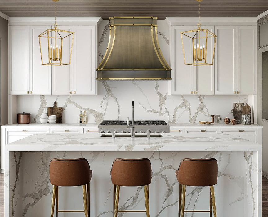custom brass range hood in luxury brushed antique brass finish with polished brass straps and black square rivets at RangeHoodMaster