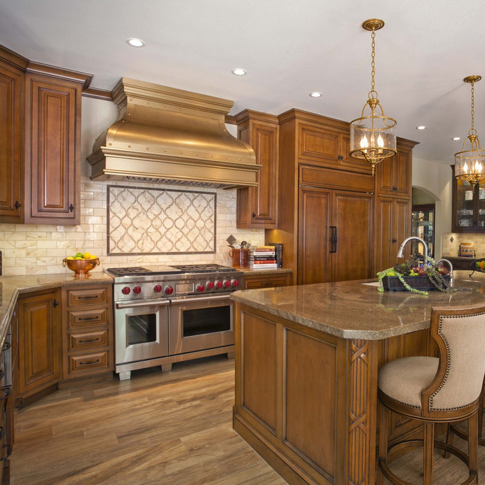Luxury metal stove hood with rivet trim for classic transitional kitchen remodel