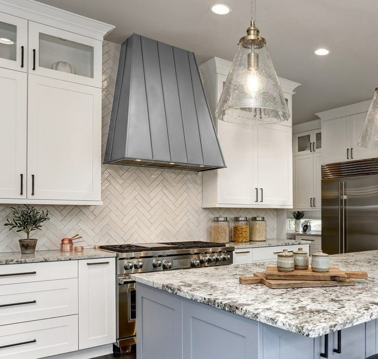 Natural zinc tapered custom range hood with standing seams at rangehoodmaster