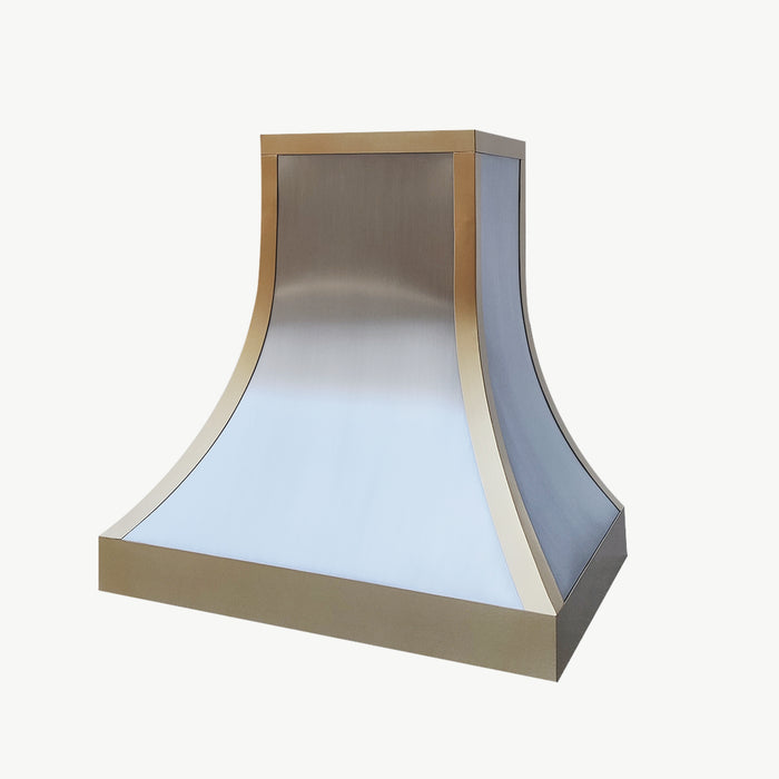 Stainless steel range hood custom curved design with brushed brass straps and apron from RangeHoodMaster