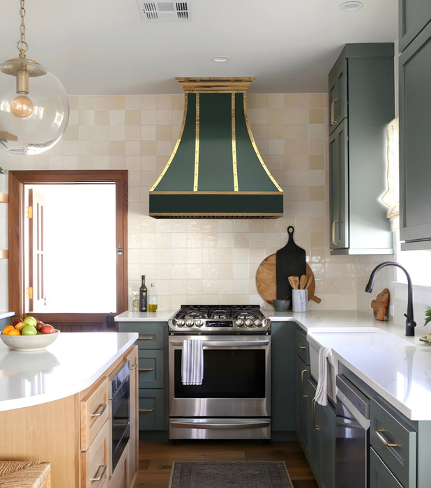 Custom stainless steel range hood in essex green angled shape with polished brass crown molding and straps at RangeHoodMaster