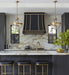 custom black range hood modern curve with brass straps and pot rack at rangehoodmaster