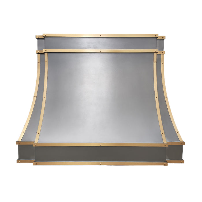 Custom metal range hood in kitchen made with pure zinc material and brushed brass straps and small round rivets