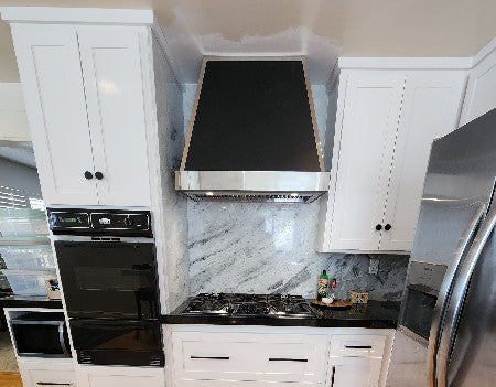 custom black stainless steel range hood with silver mirror straps at RangeHoodMaster