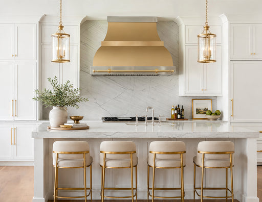Custom warm brass range hood with luxury pot rack in designer kitchen interior at rangehoodmaster