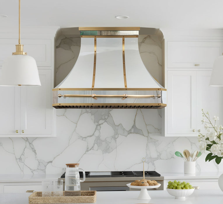 white stainless steel range hood with sleek brushed brass accents and pot rail at RangeHoodMaster