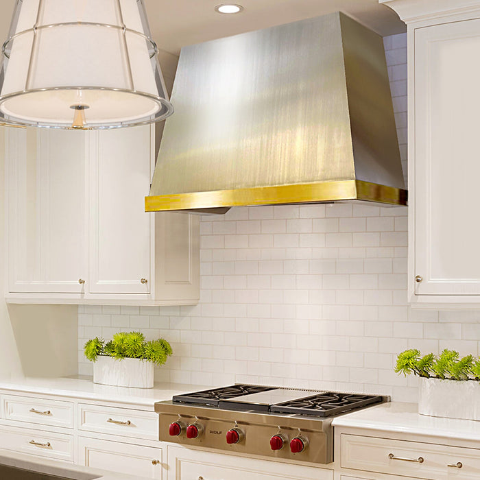 Angled Brushed Stainless Steel Custom Range Hood with brushed brass apron