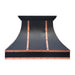Matte black kitchen hood with copper rivet trim